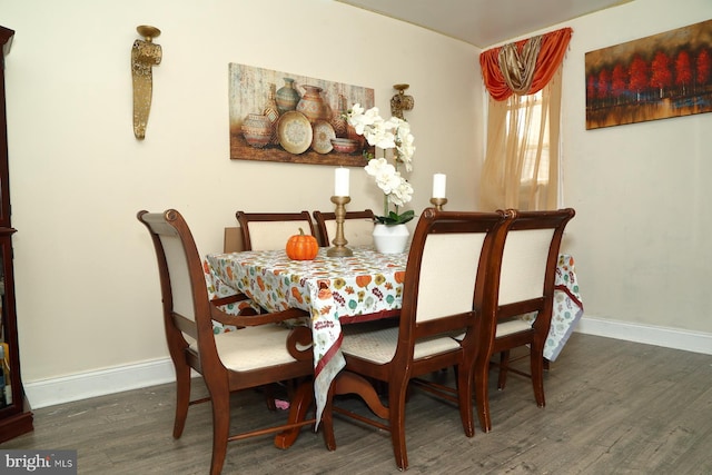 dining area featuring dark hardwood / wood-style flooring