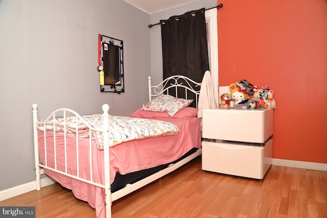 bedroom featuring hardwood / wood-style flooring