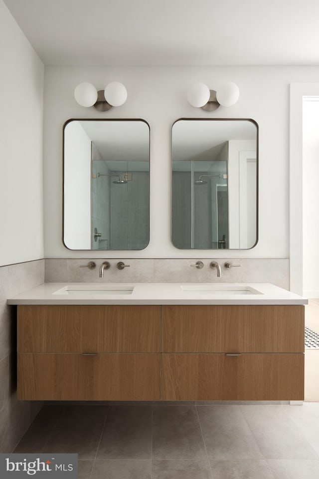 bathroom with vanity and an enclosed shower