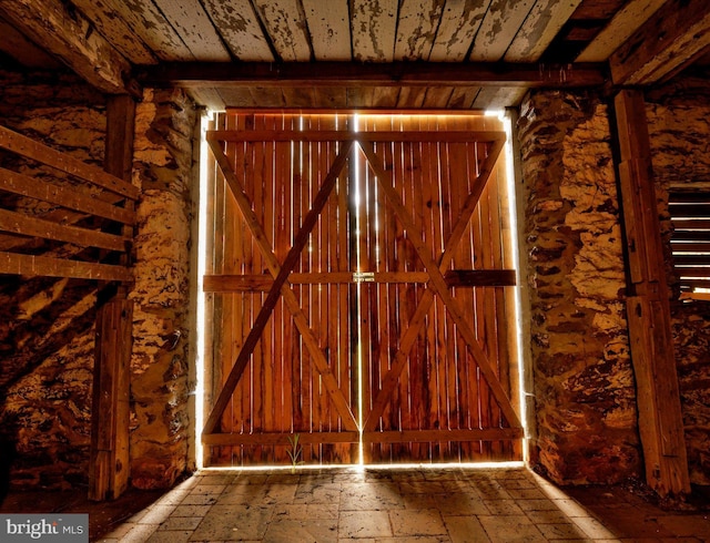 interior space featuring beamed ceiling and wooden ceiling