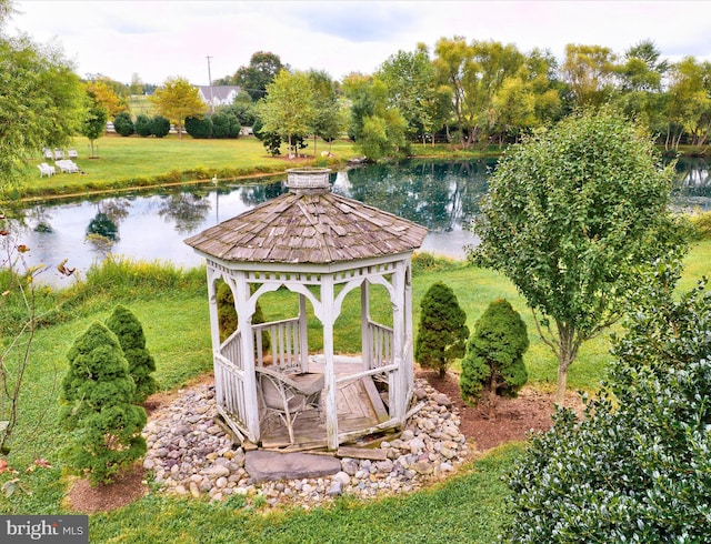 view of yard featuring a water view and a gazebo