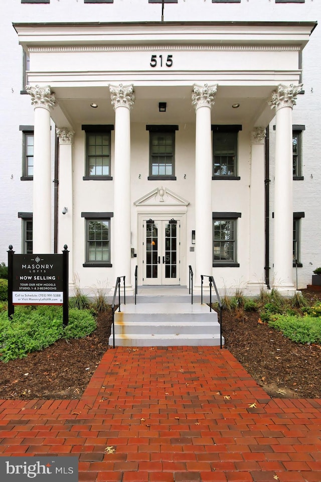 property entrance with a porch and french doors