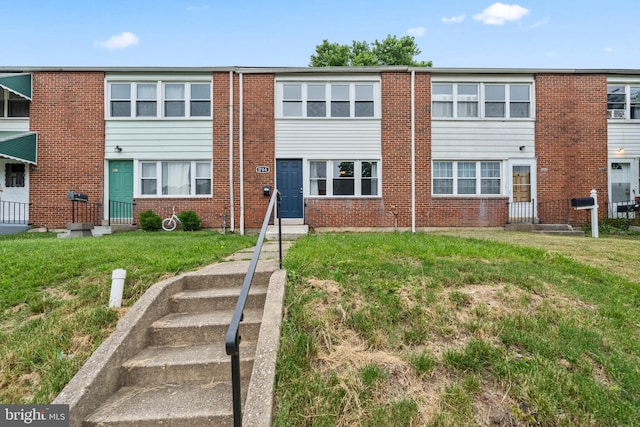 view of front of property with a front lawn