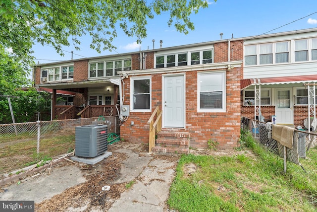 rear view of property with central air condition unit