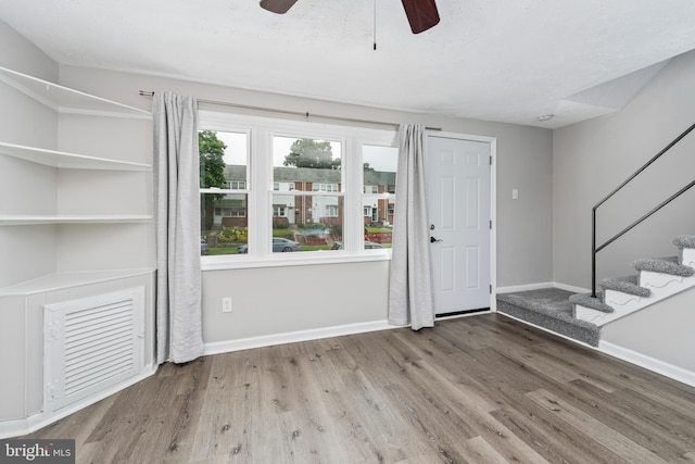 1704 Melbourne Rd, Dundalk, MD 21222 - foyer with a ceiling fan, baseboards, stairway, and wood finished floors