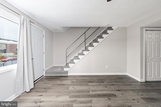 1704 Melbourne Rd, Dundalk, MD 21222 - foyer featuring baseboards, wood finished floors, and stairway