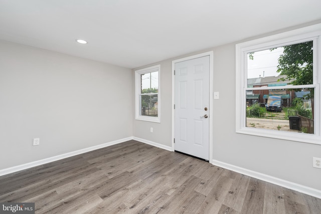 foyer entrance with light hardwood / wood-style flooring