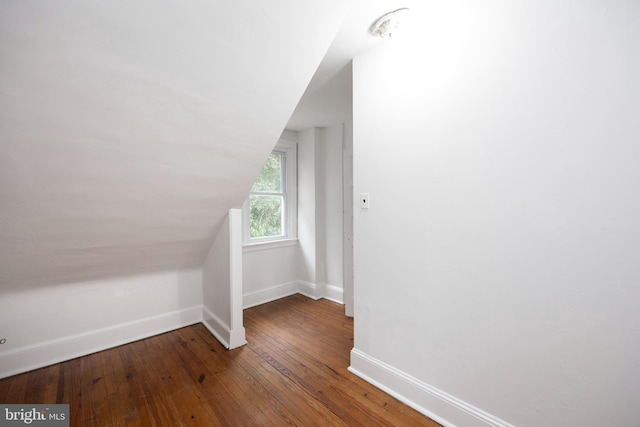 bonus room featuring hardwood / wood-style flooring and vaulted ceiling