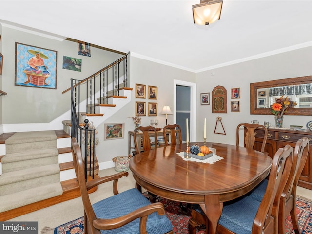 dining space featuring ornamental molding