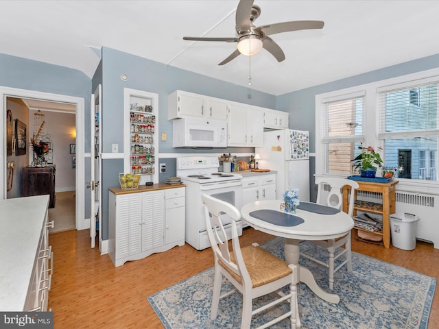 kitchen with white appliances, ceiling fan, light wood-type flooring, and white cabinetry