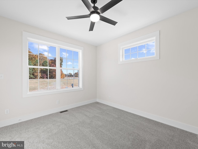 carpeted empty room with ceiling fan