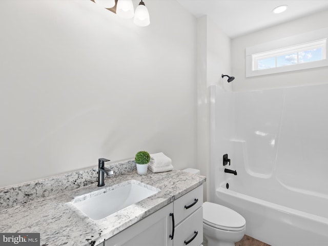 full bathroom featuring vanity, toilet, and bathtub / shower combination