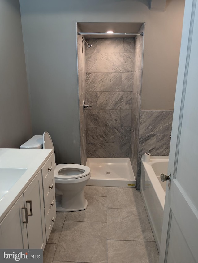 full bathroom with vanity, toilet, plus walk in shower, and tile patterned floors