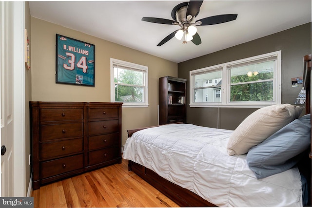 bedroom featuring light hardwood / wood-style flooring and ceiling fan