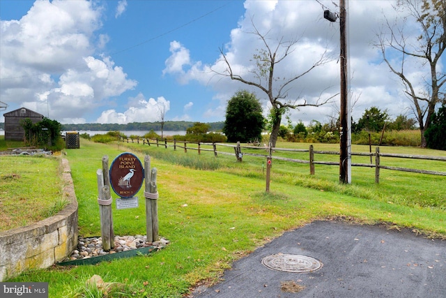 exterior space with a rural view and a yard