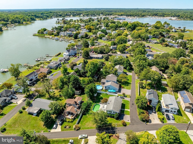 birds eye view of property with a water view and a residential view