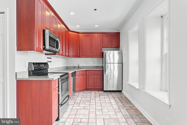 kitchen featuring light stone countertops, stainless steel appliances, tasteful backsplash, and crown molding