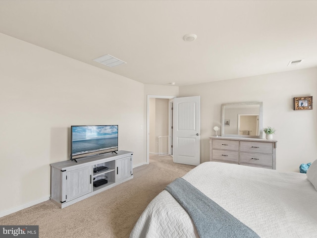 bedroom with light colored carpet