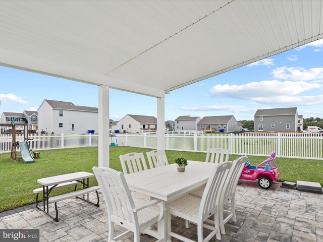 view of patio featuring a playground