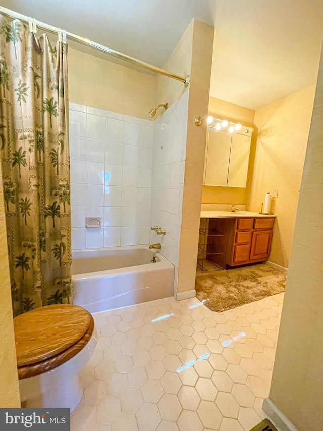 full bathroom with shower / bathtub combination with curtain, toilet, vanity, and tile patterned floors