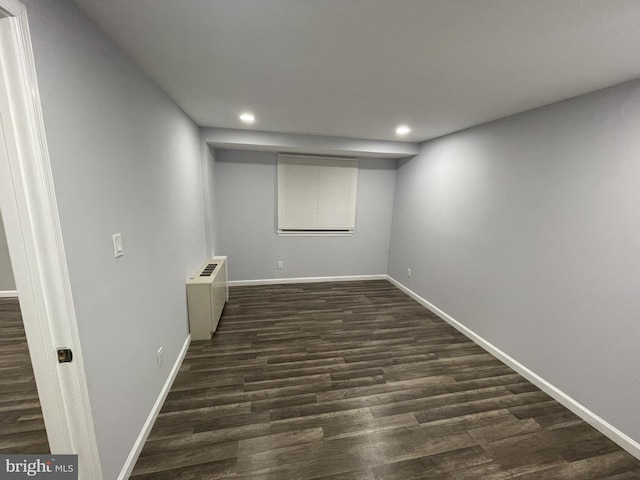 unfurnished room with dark hardwood / wood-style floors