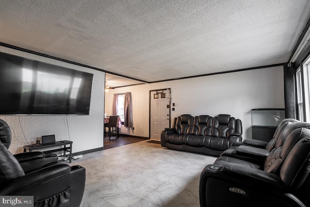 living room featuring ornamental molding and a textured ceiling