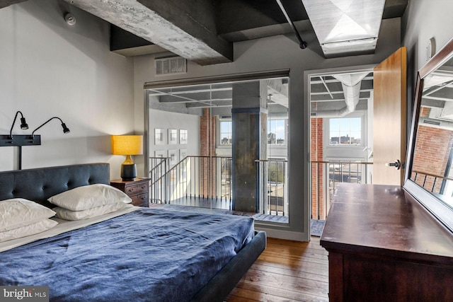 bedroom with hardwood / wood-style flooring