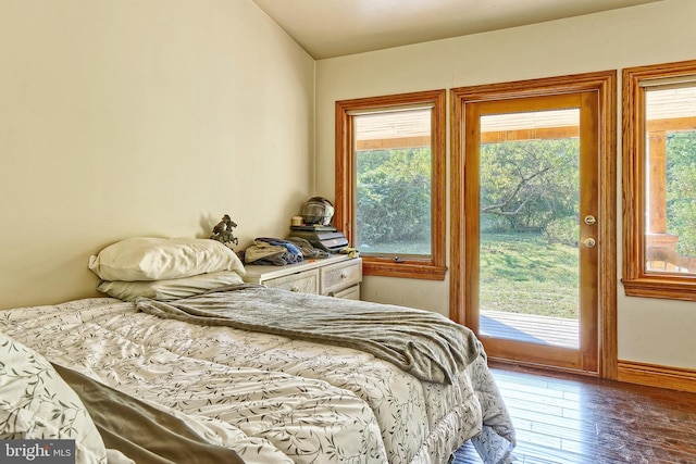 bedroom featuring hardwood / wood-style flooring and access to exterior