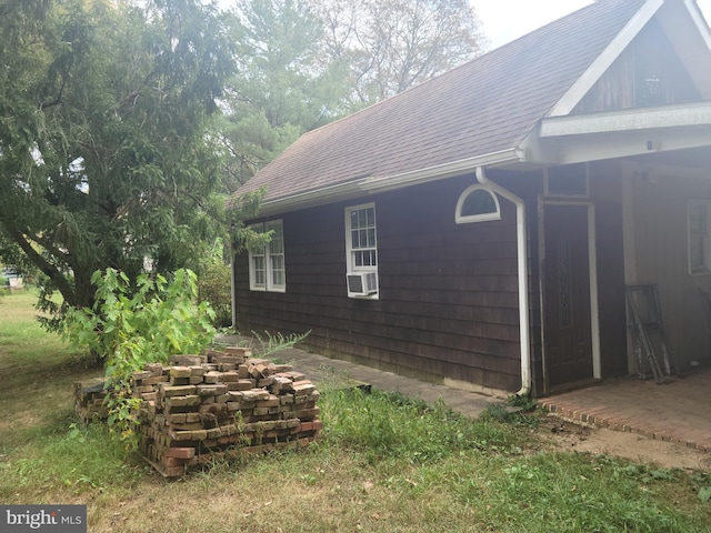 view of property exterior with a patio and cooling unit