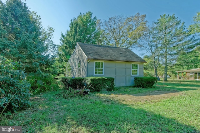 view of outdoor structure with a lawn