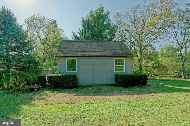 view of outdoor structure with a yard