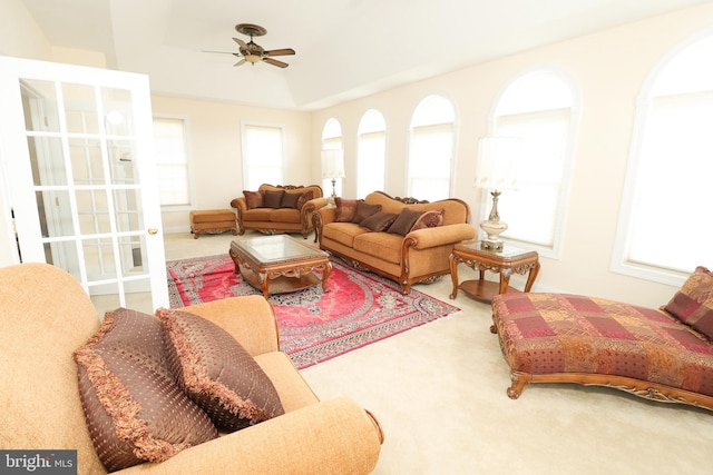 living room with carpet and ceiling fan