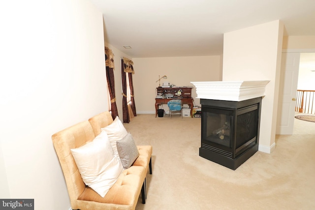 living area featuring carpet and a multi sided fireplace