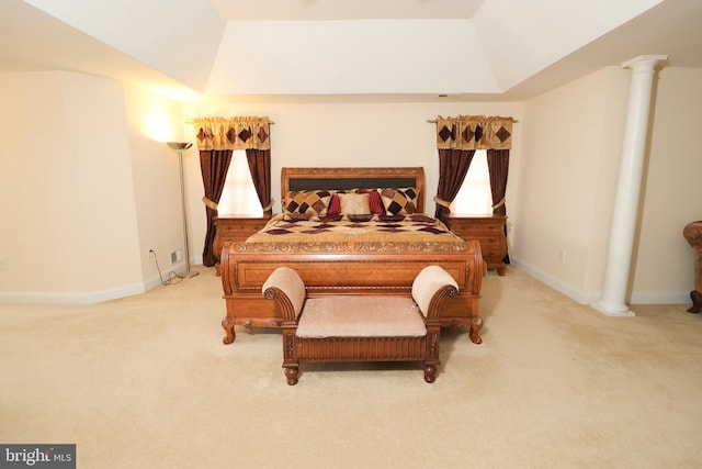 carpeted bedroom with decorative columns