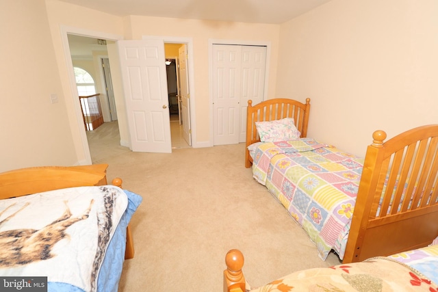 carpeted bedroom with a closet