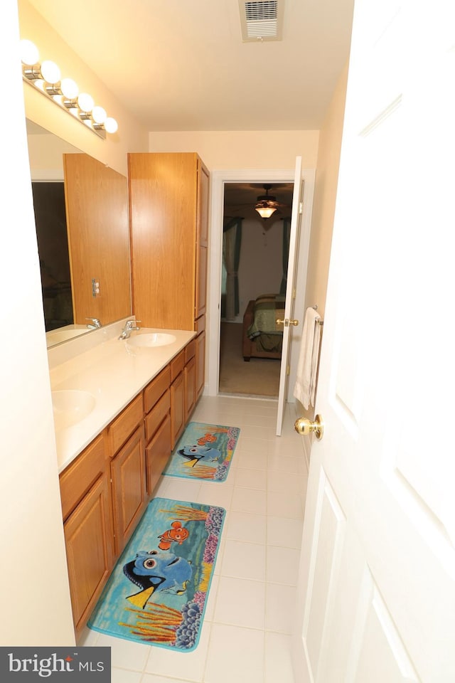 bathroom with tile patterned flooring and vanity