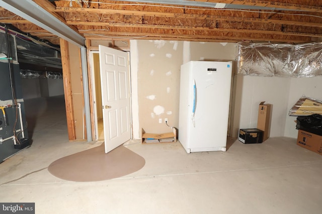 basement with white fridge