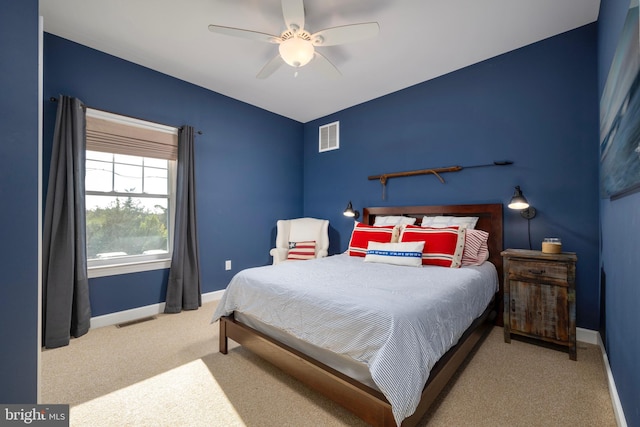 bedroom featuring light carpet and ceiling fan