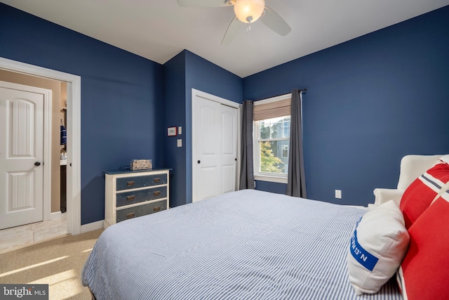 bedroom with carpet flooring, ceiling fan, and a closet