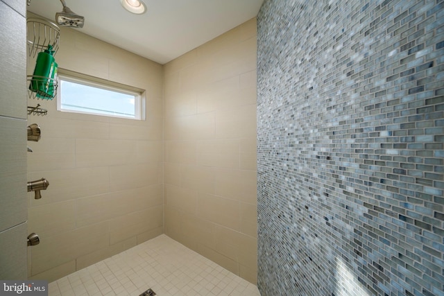 bathroom with tiled shower