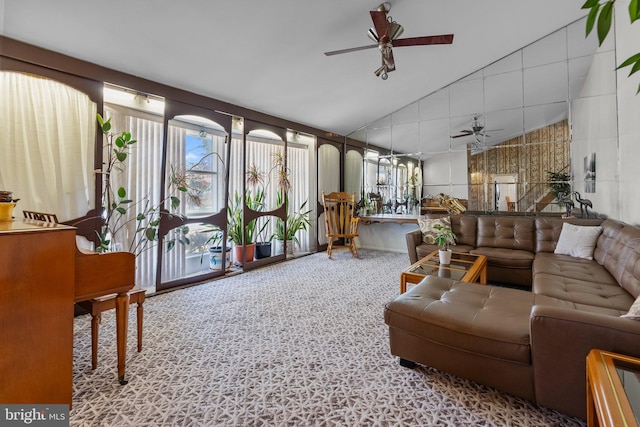 interior space featuring ceiling fan and vaulted ceiling