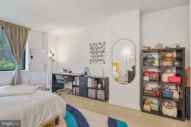 bedroom with wood-type flooring