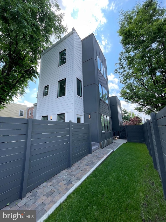 view of home's exterior with a yard