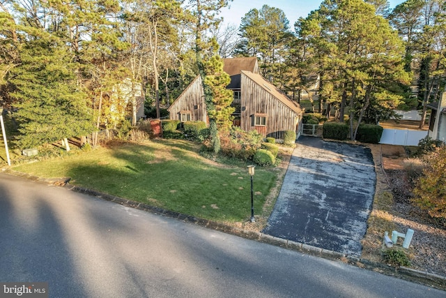 view of home's exterior with a lawn