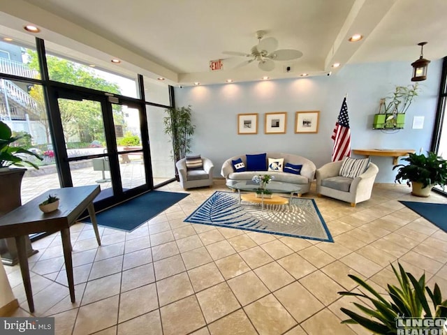 community lobby featuring light tile patterned floors and ceiling fan