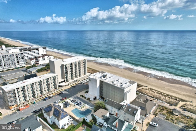 bird's eye view featuring a beach view and a water view