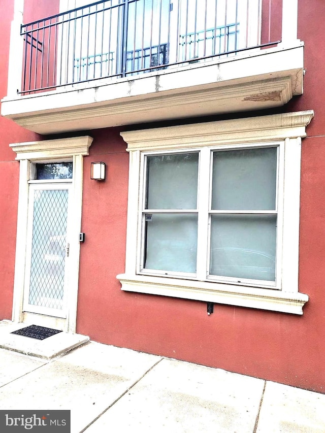 property entrance with a balcony