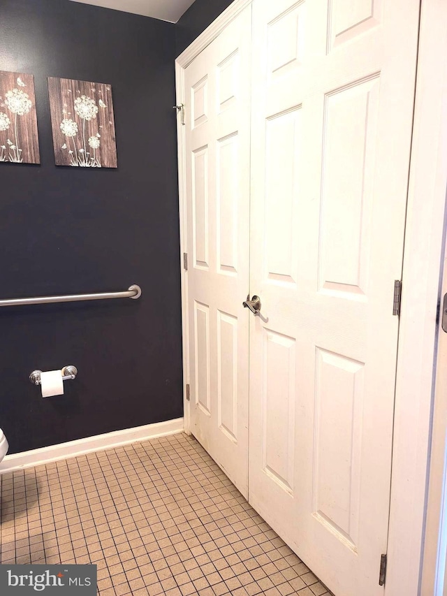 bathroom with tile patterned flooring