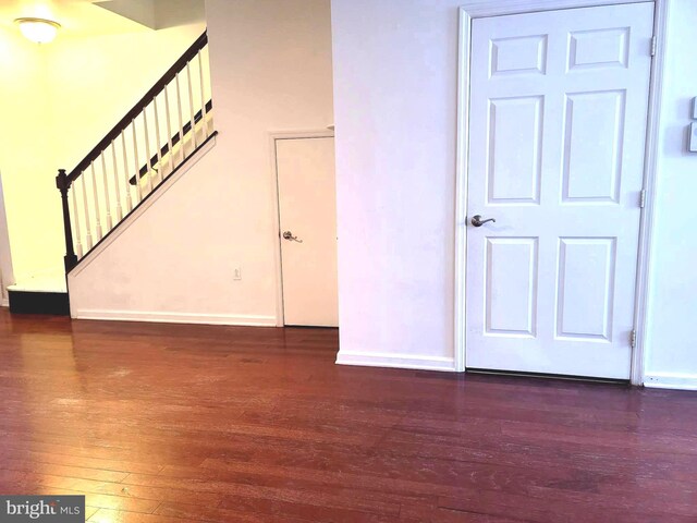 interior space with dark wood-type flooring