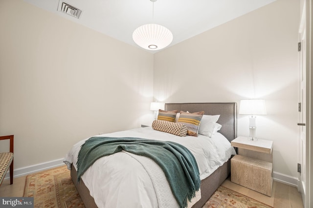 bedroom featuring wood-type flooring